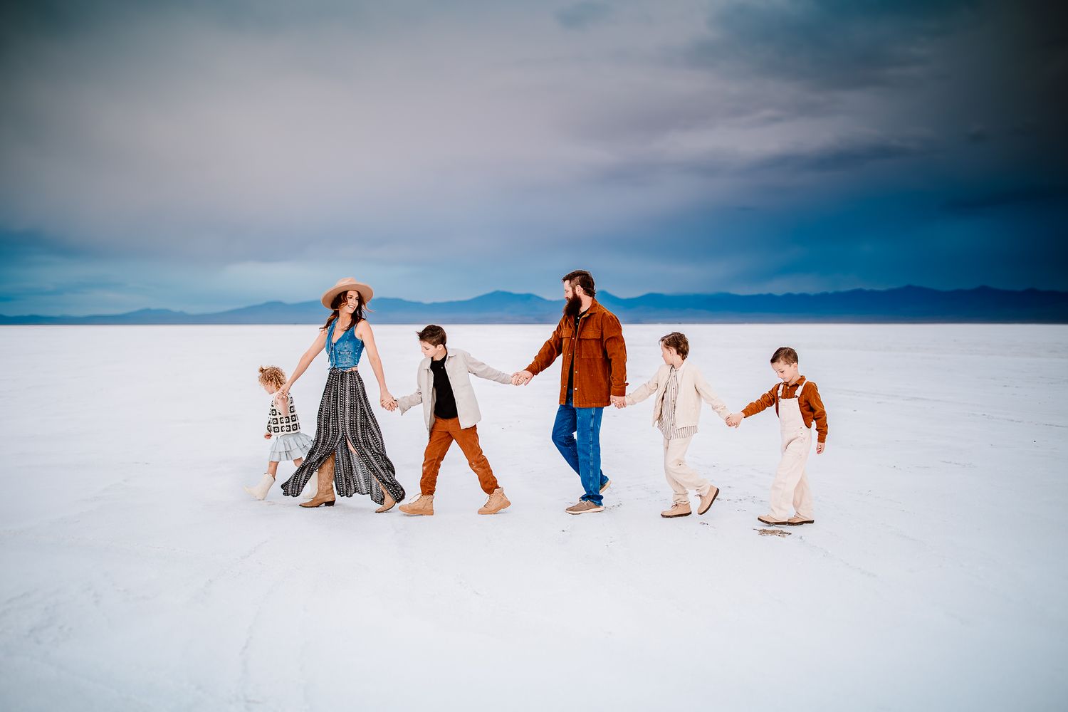 A family walking hand-in-hand, authentic and heartfelt family moments.
