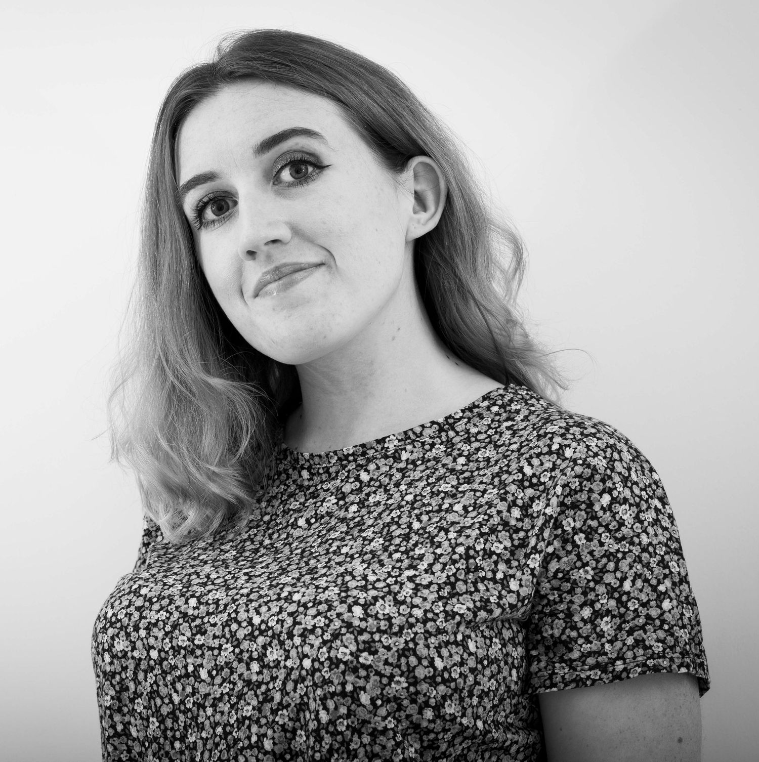 Black and white portrait of a Hannah Templer, business owner of Hannah's Photography.