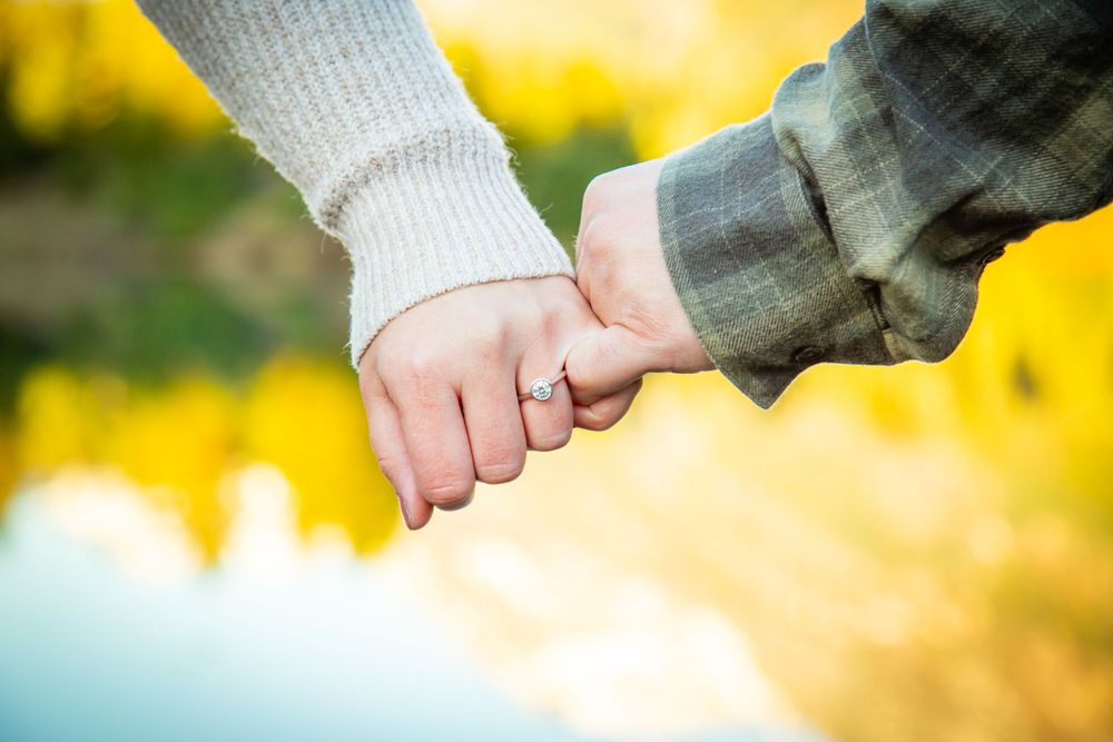 Man and woman pose for an engagement photography photoshoot at Gold Creek Ponds at Snoqualmie Pass, WA