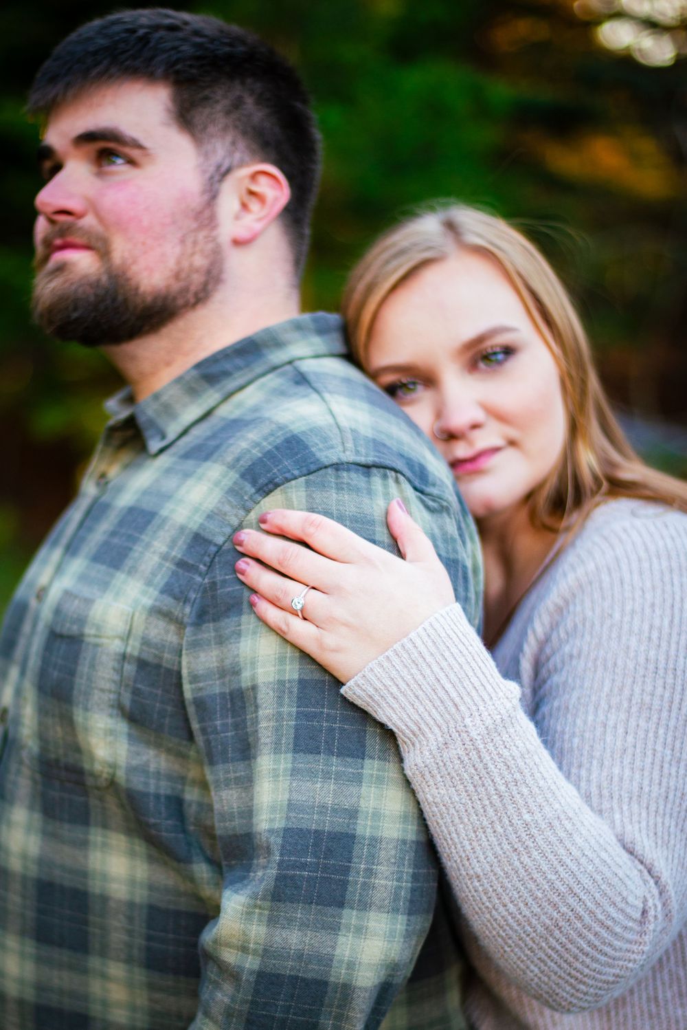 Man and woman pose for an engagement photography photoshoot at Gold Creek Ponds at Snoqualmie Pass, WA
