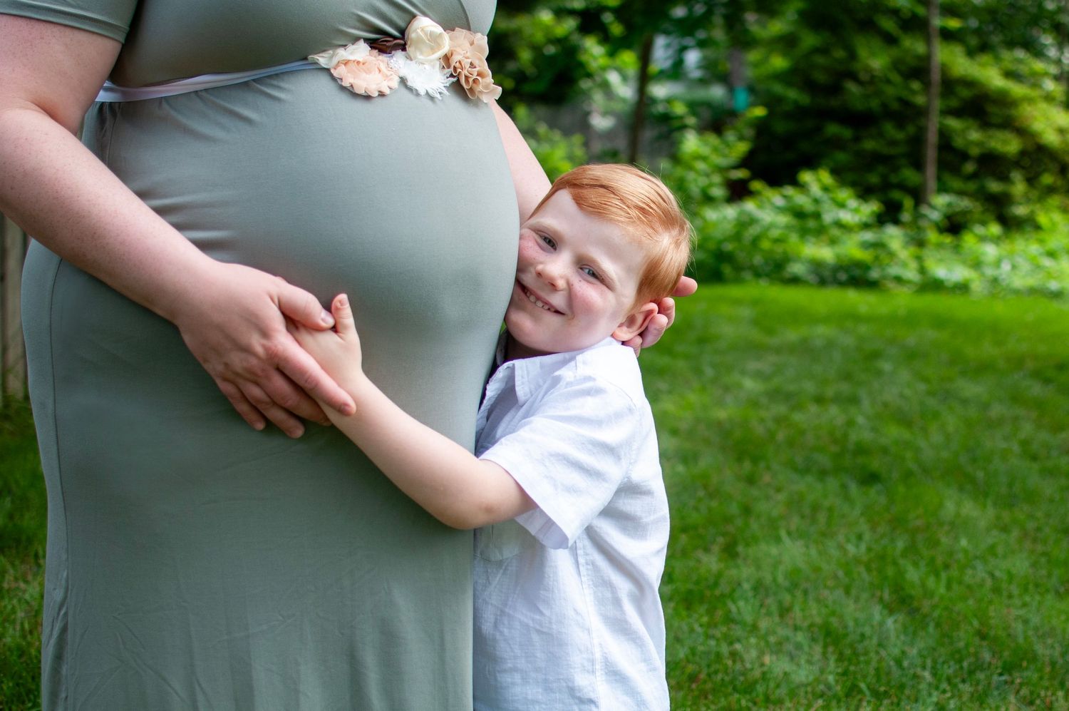 Little boy with mama belly pregnant photo