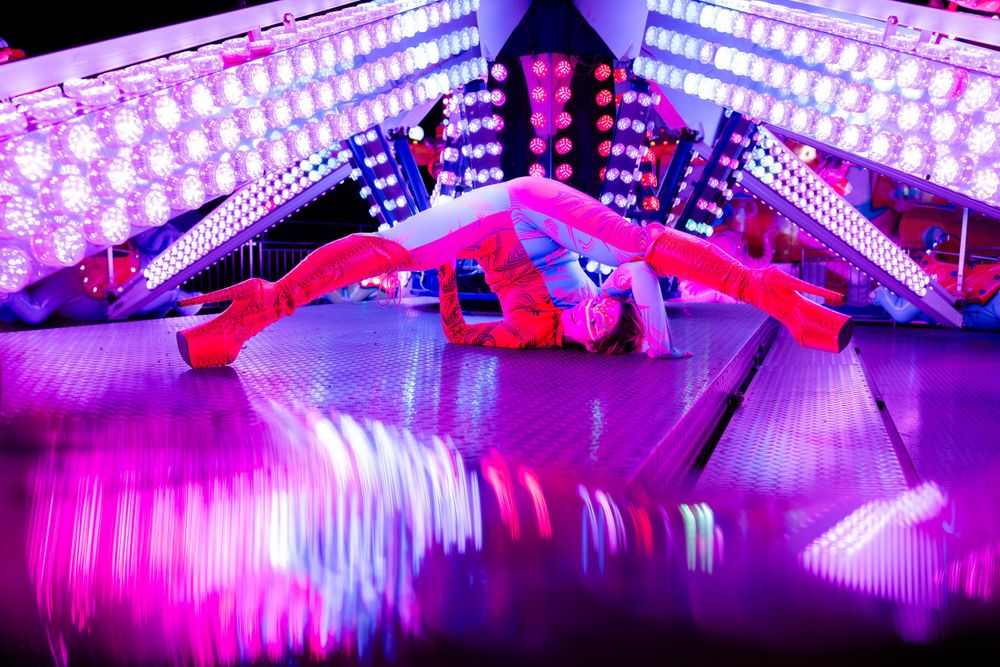 Abstract purple and blue LED light installation creating geometric patterns.