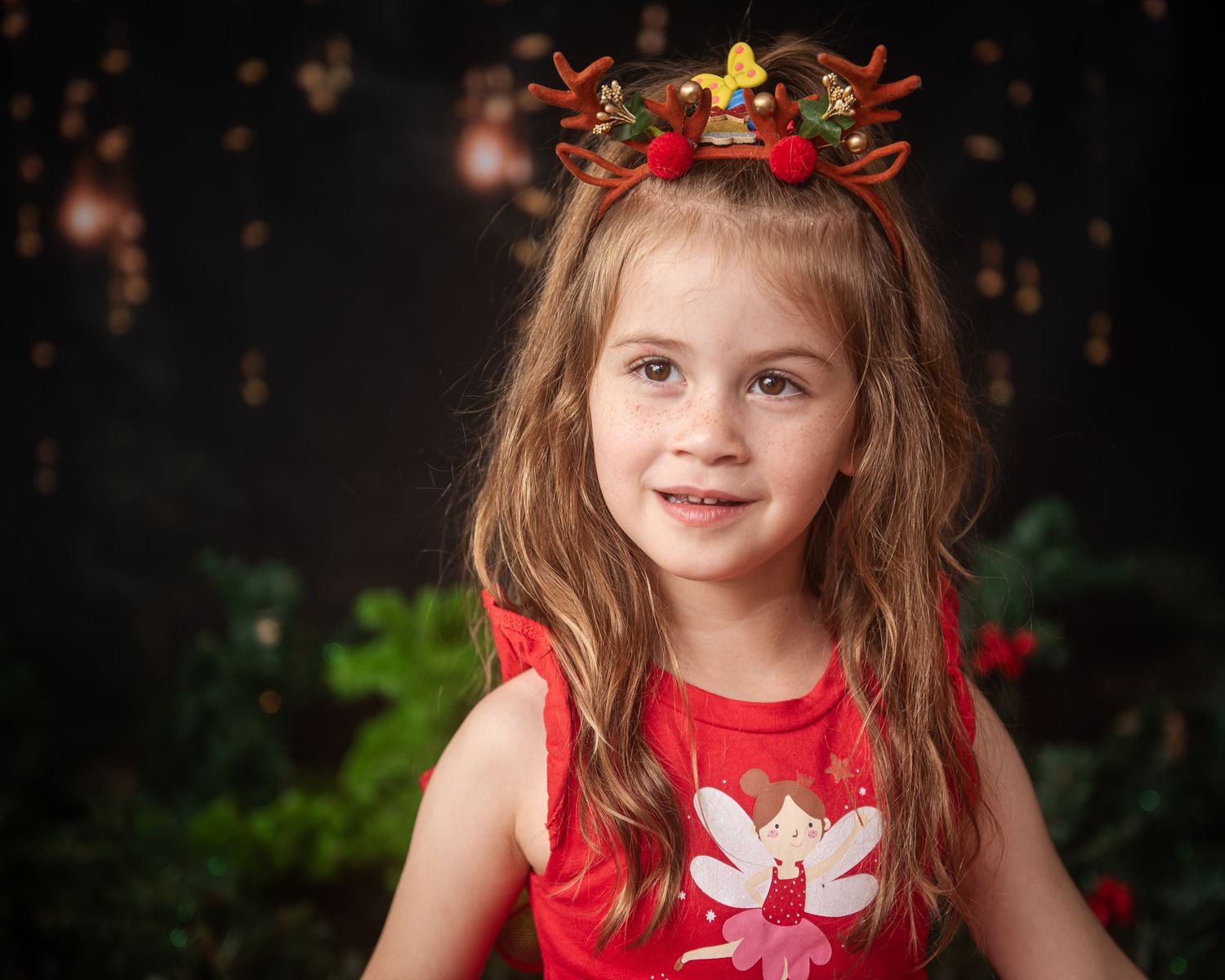 Festive holiday portraits with red bows and decorative Christmas elements.