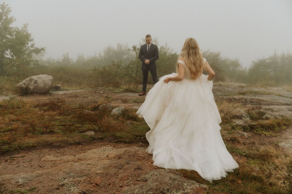 artistically Alexia photography m and j elopement bride walking to groom first look