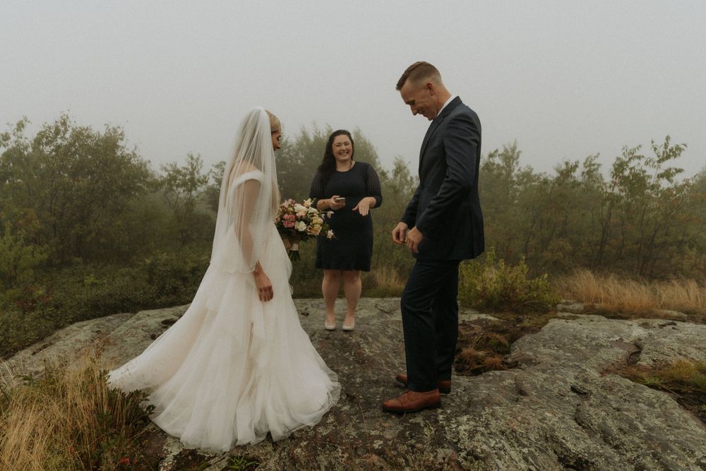 artistically Alexia photography m and j elopement bride and groom at the mountaintop altar