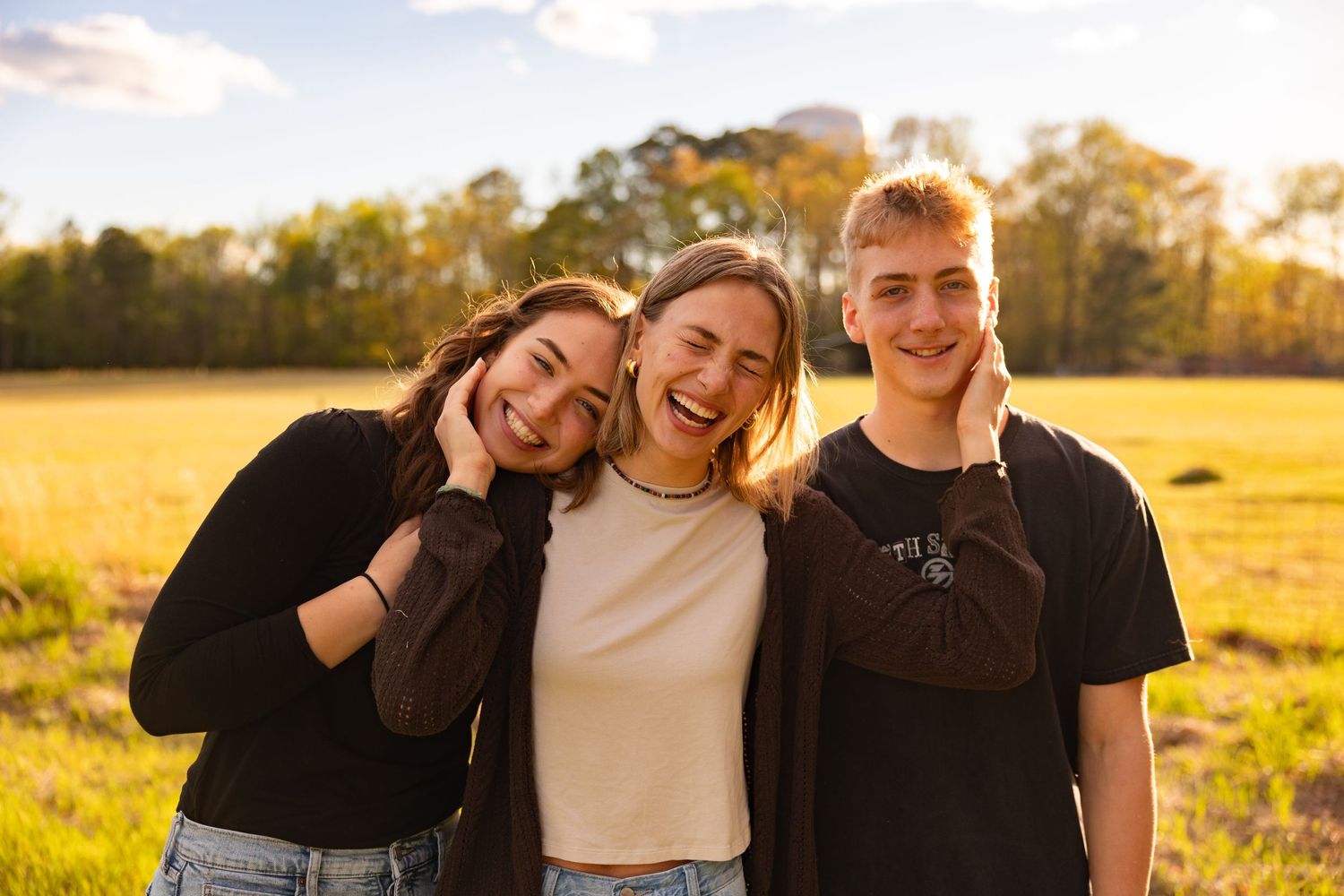 Family hugging each other and laughing