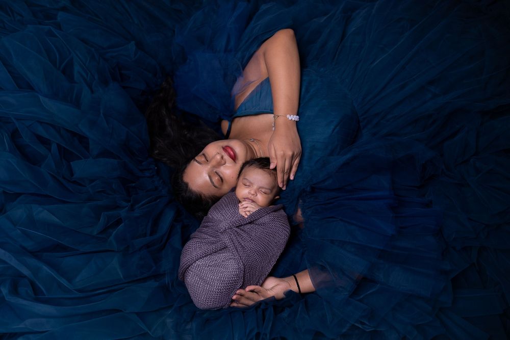 A series of dark blue-tinted photos showing someone reclining against a textured background.