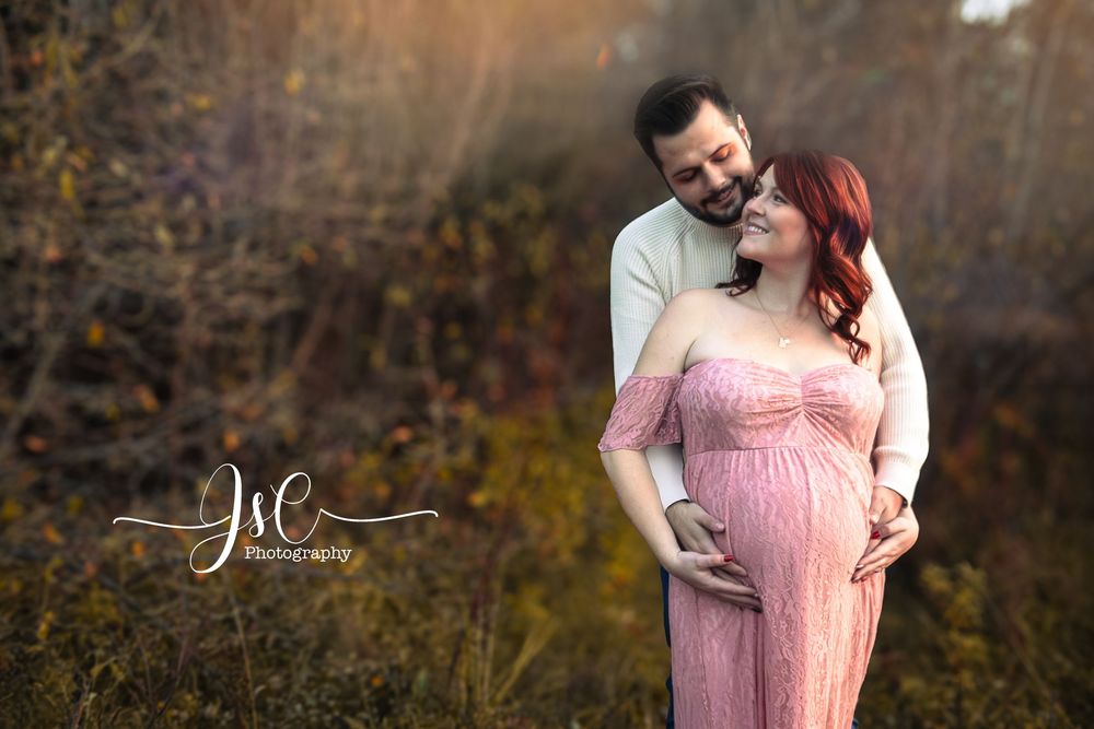 Romantic outdoor portrait session in autumn setting with warm lighting.