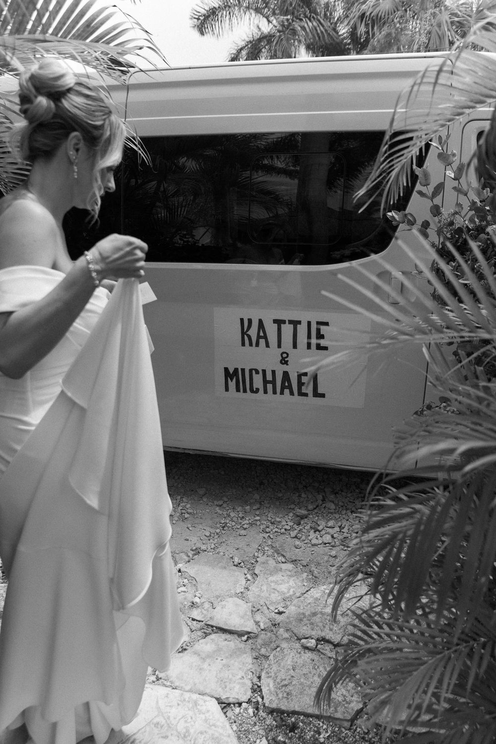 A collage of black and white photos showing names 'Katie' and 'Michael' written on car windows with palm trees in background.
