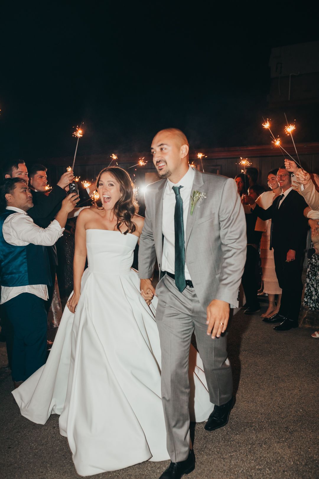 A couple celebrates with sparklers at their evening wedding reception. Pittsburgh wedding Photographer