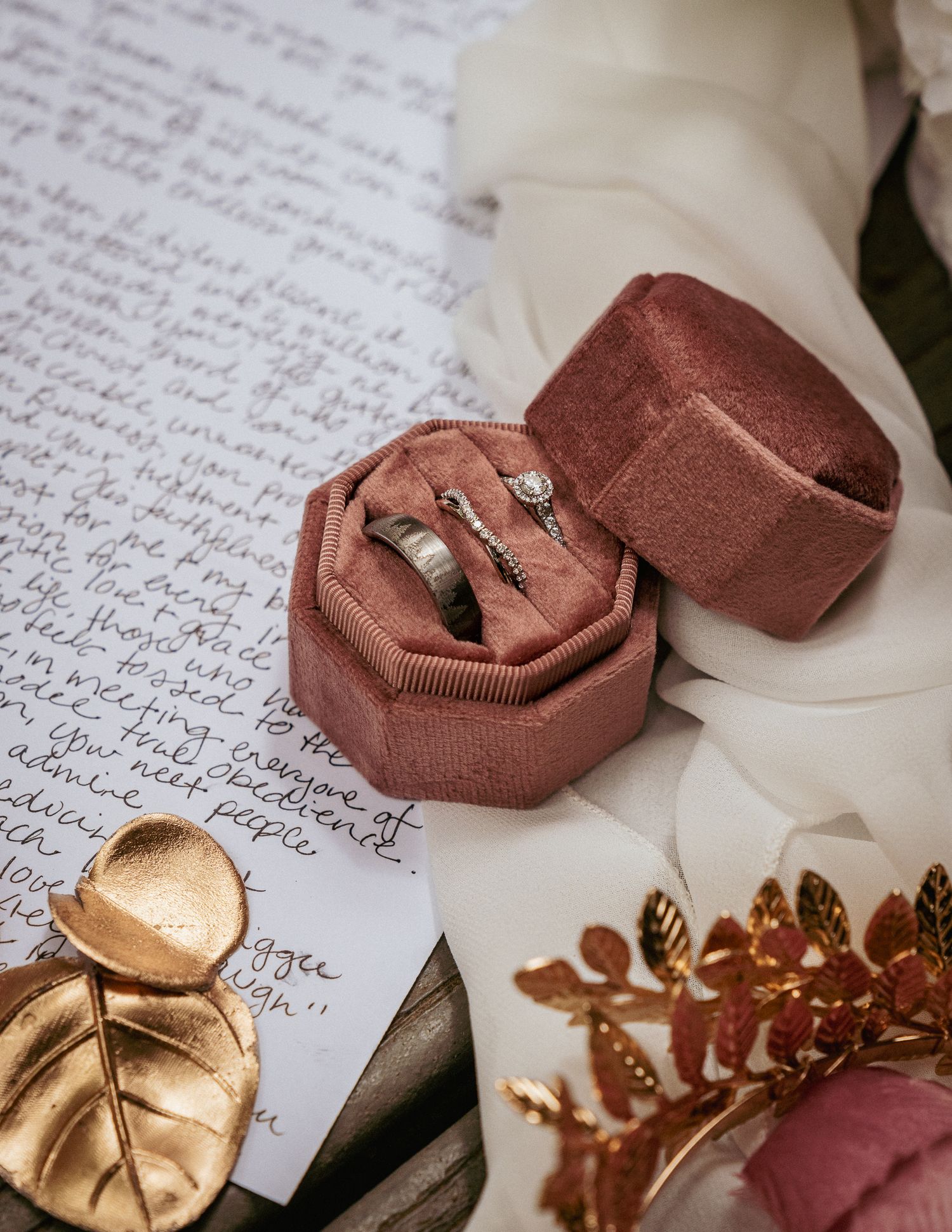 Velvet ring box with wedding vows and gold details, romantic flat lay.