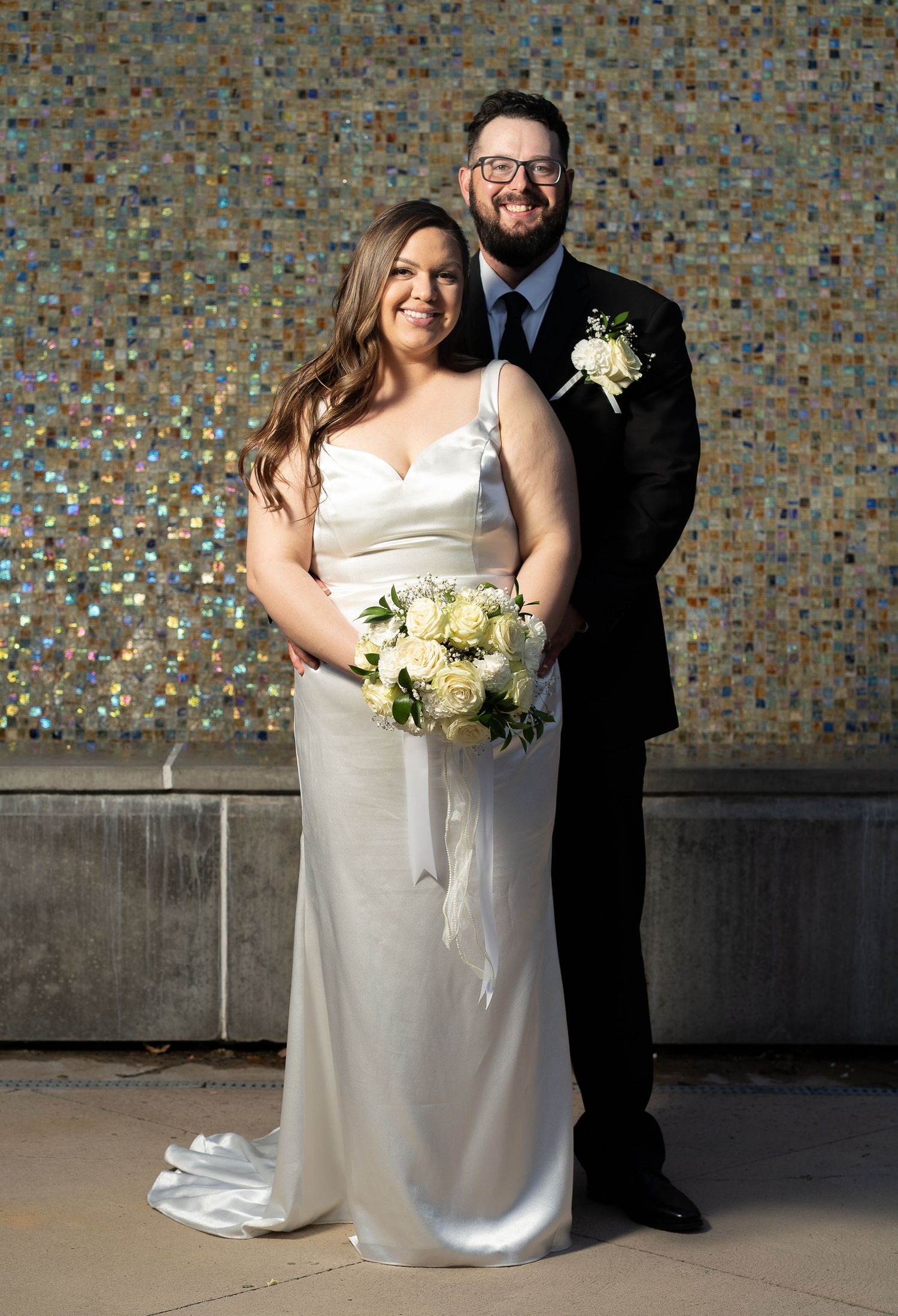 Bride and groom in front logan utah wedding venue Local Wedding Photographer
