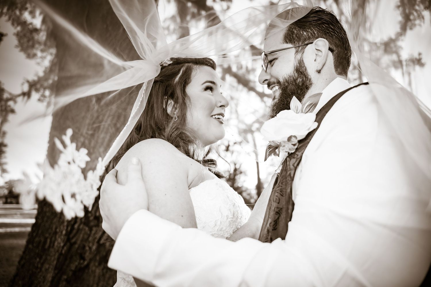 Classic black and white wedding photos showing romantic moments between a couple.