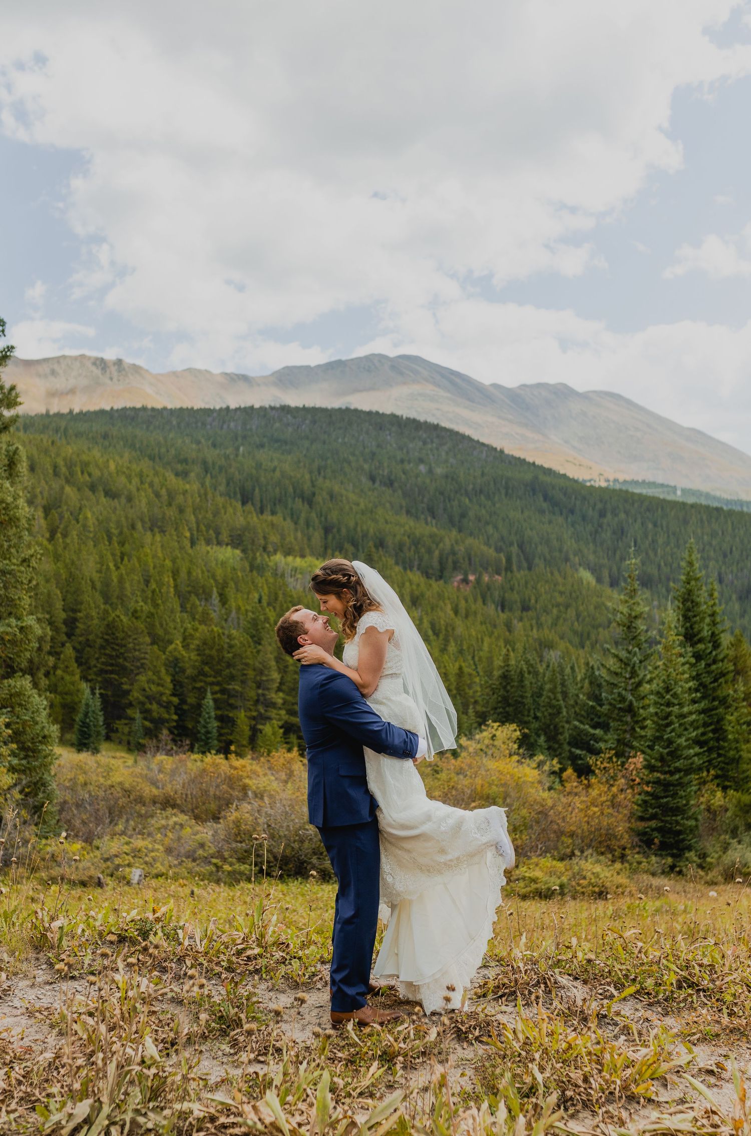 Bride and groom share a kiss at Sapphire Point Overlook during their Breckenridge elopement.