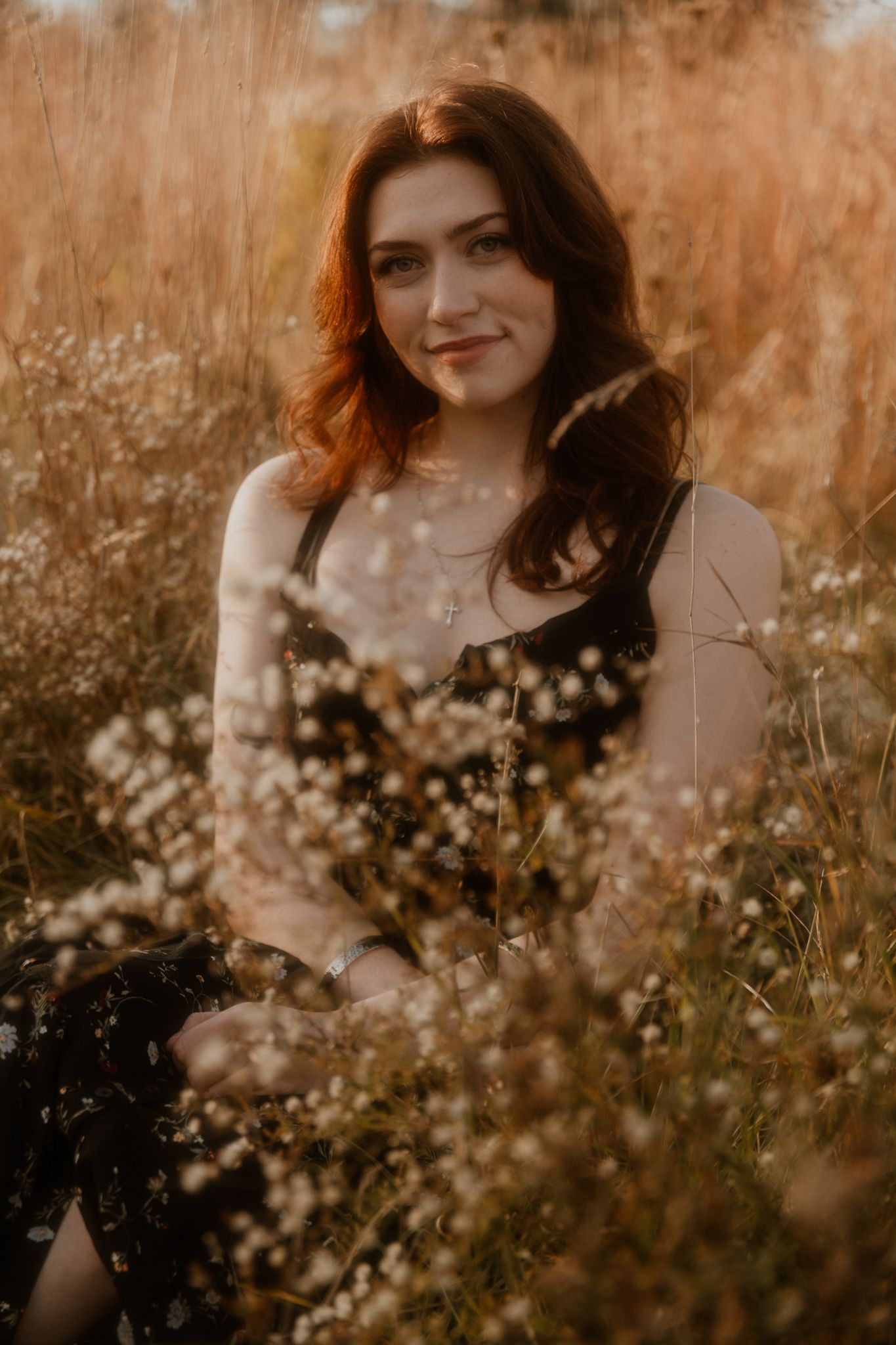 Delicate white wildflowers in a field during golden hour with soft bokeh effects.