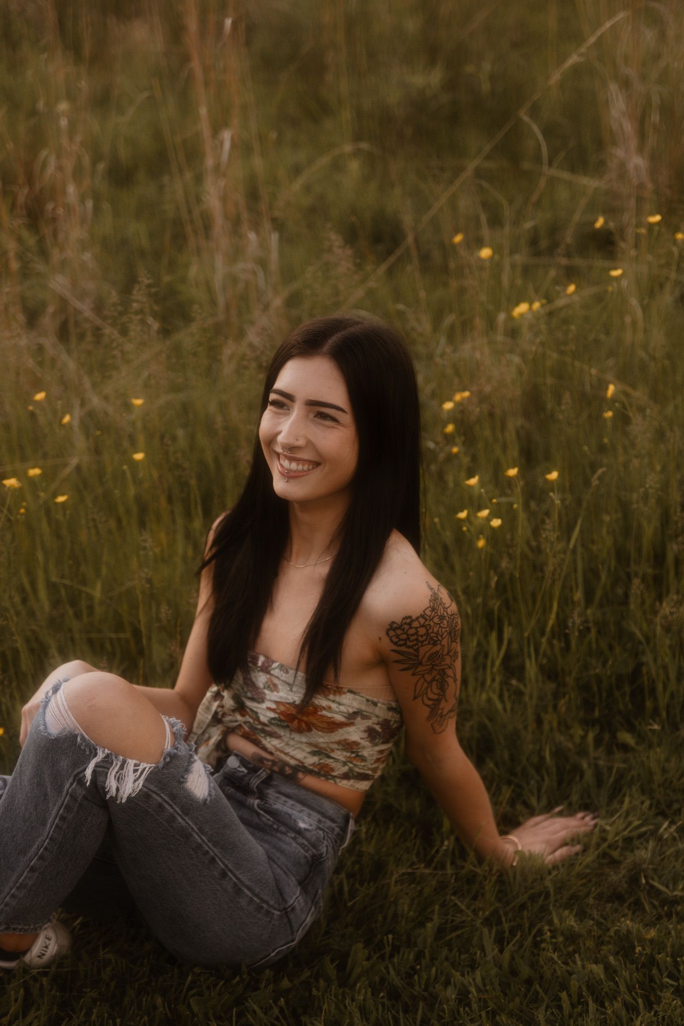 Casual portrait session in a wildflower field during golden hour.
