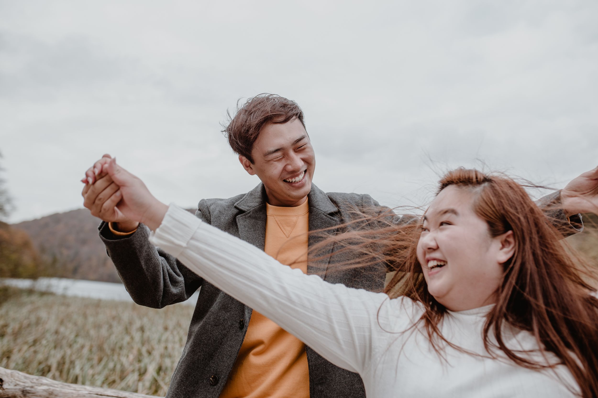 Close-up of the couple laughing and enjoying each other’s company during their vacation photoshoot at Plitvice.