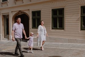 Family walking together, sharing a loving moment during their Upper Town vacation shoot.
