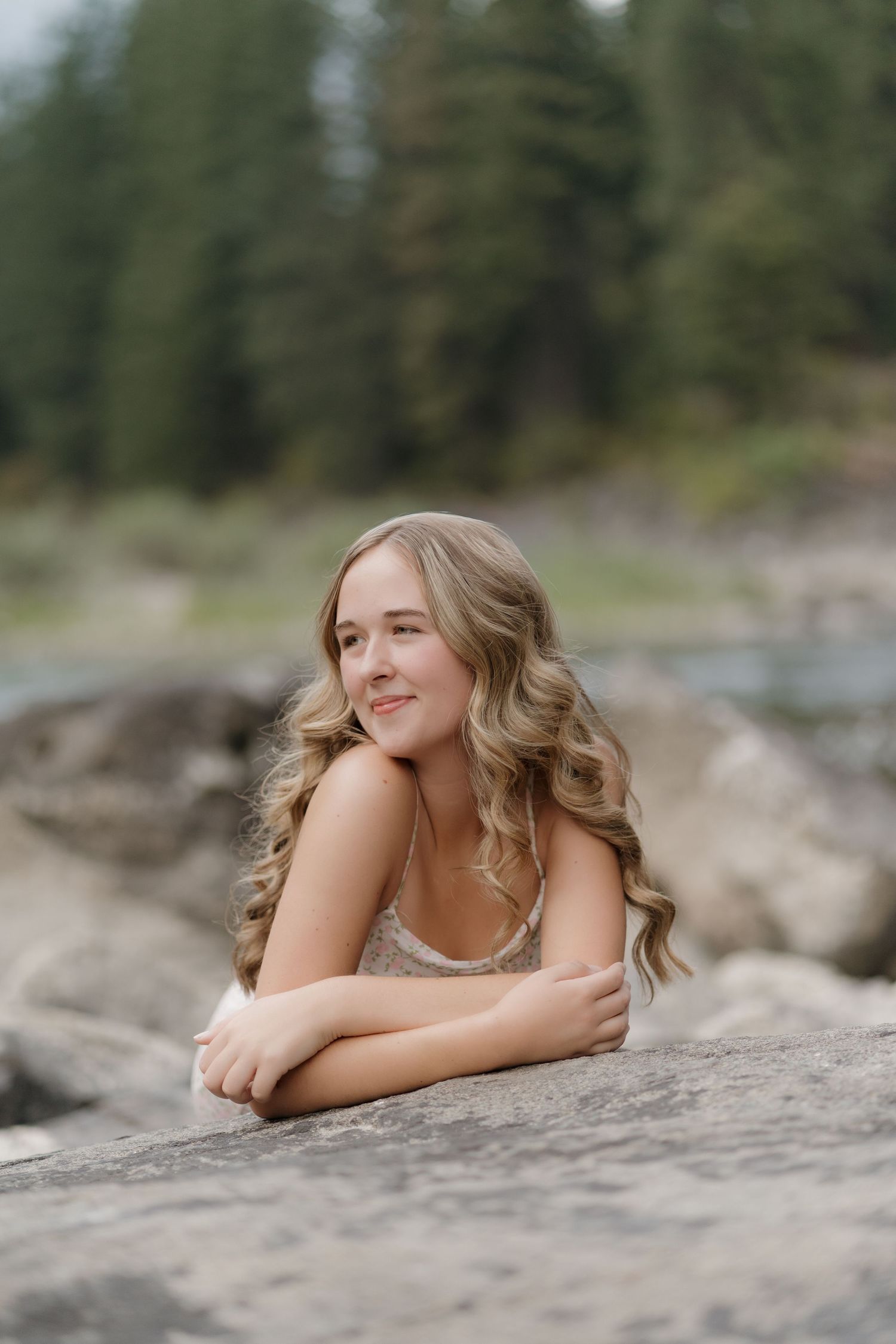 A peaceful outdoor portrait in a green forest setting with a book. Leavenworth, WA