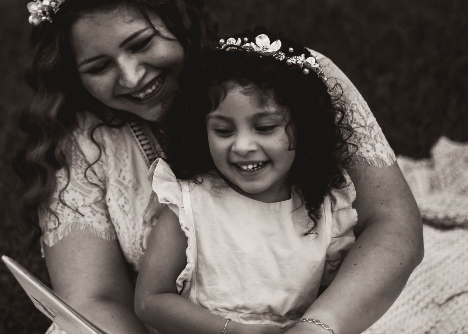 Mommy and Me styled session with mom reading a to toddler in black and white in Nichols Hills