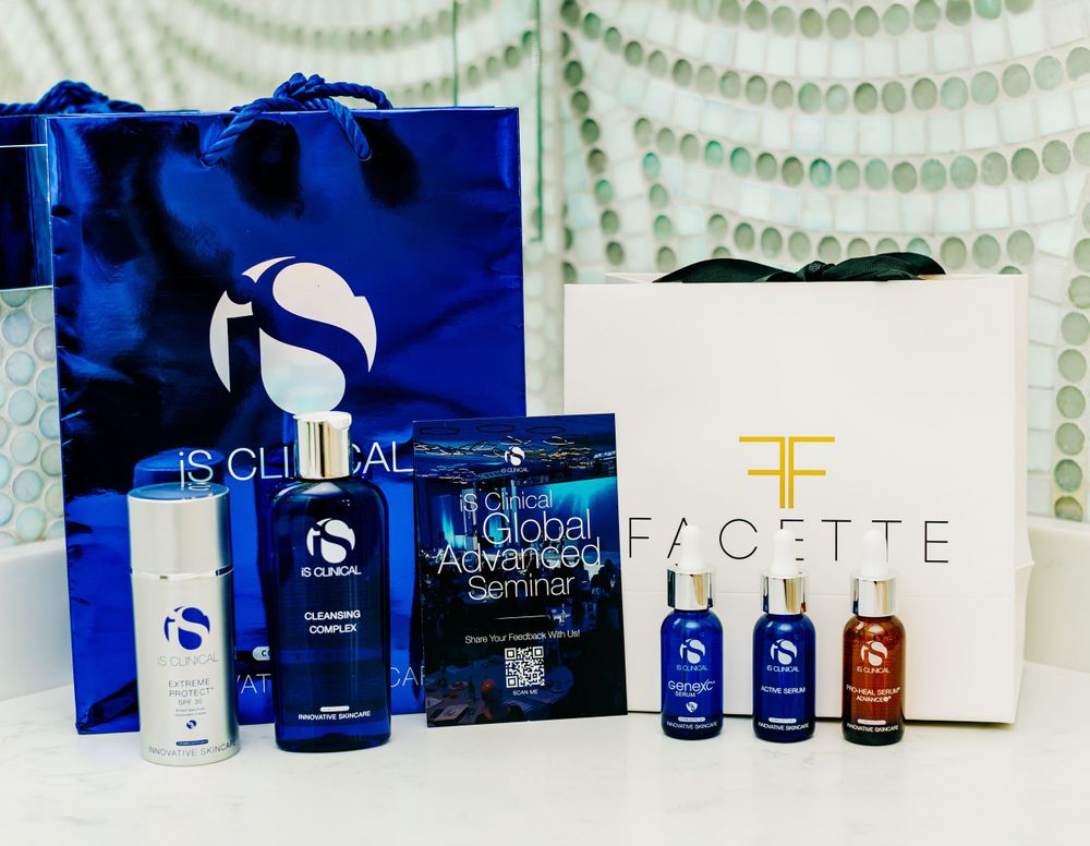 Collection of iS Clinical skincare products and Florette Beauty items displayed with a blue shopping bag.