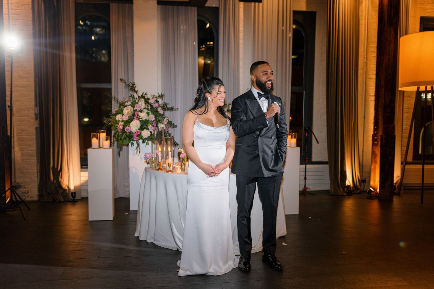 Couple standing together during their wedding reception in an elegant venue.