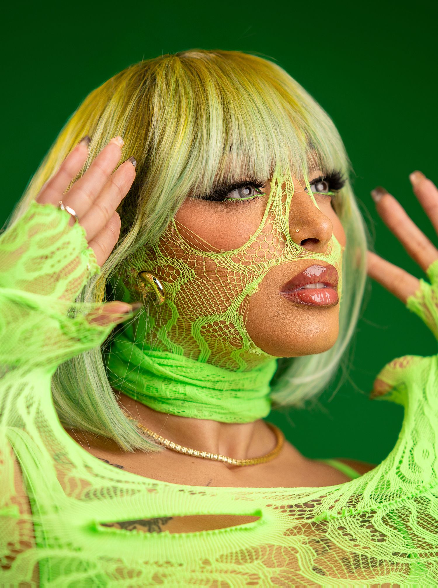 Orlando glamour portrait photographer Ray Alvarez — bold editorial glamour session with neon green styling and vibrant background