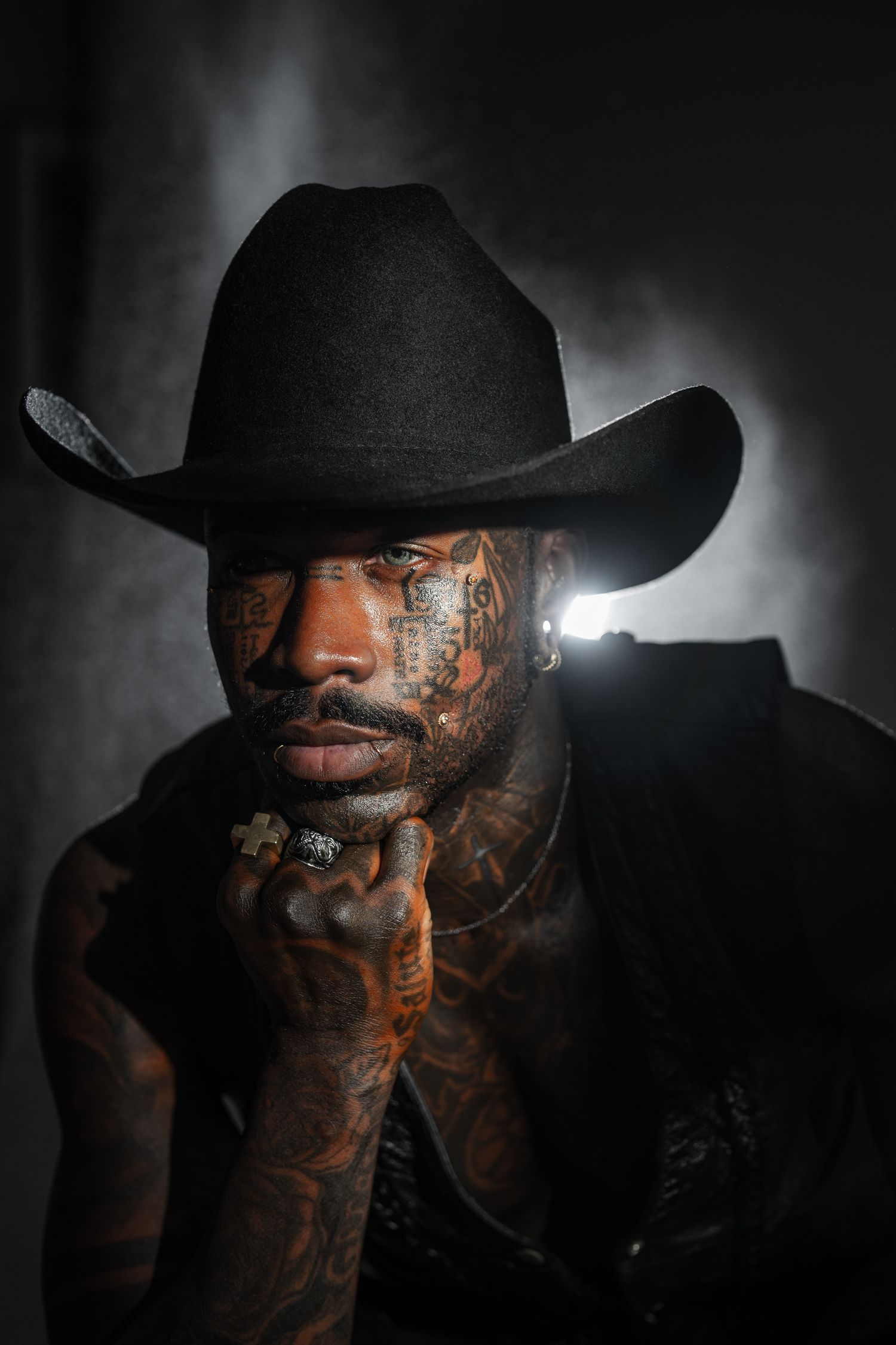 Orlando creative portrait photographer Ray Alvarez — moody studio portrait with dramatic rim lighting and bold editorial styling
