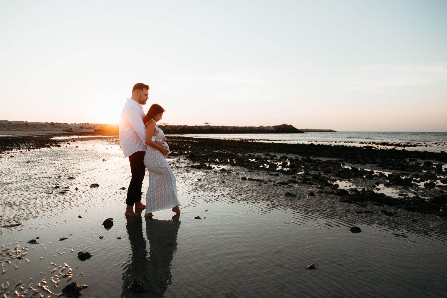 family maternity photoshoot at the beach natural light golden hour in abu dhabi lifestyle al jurf