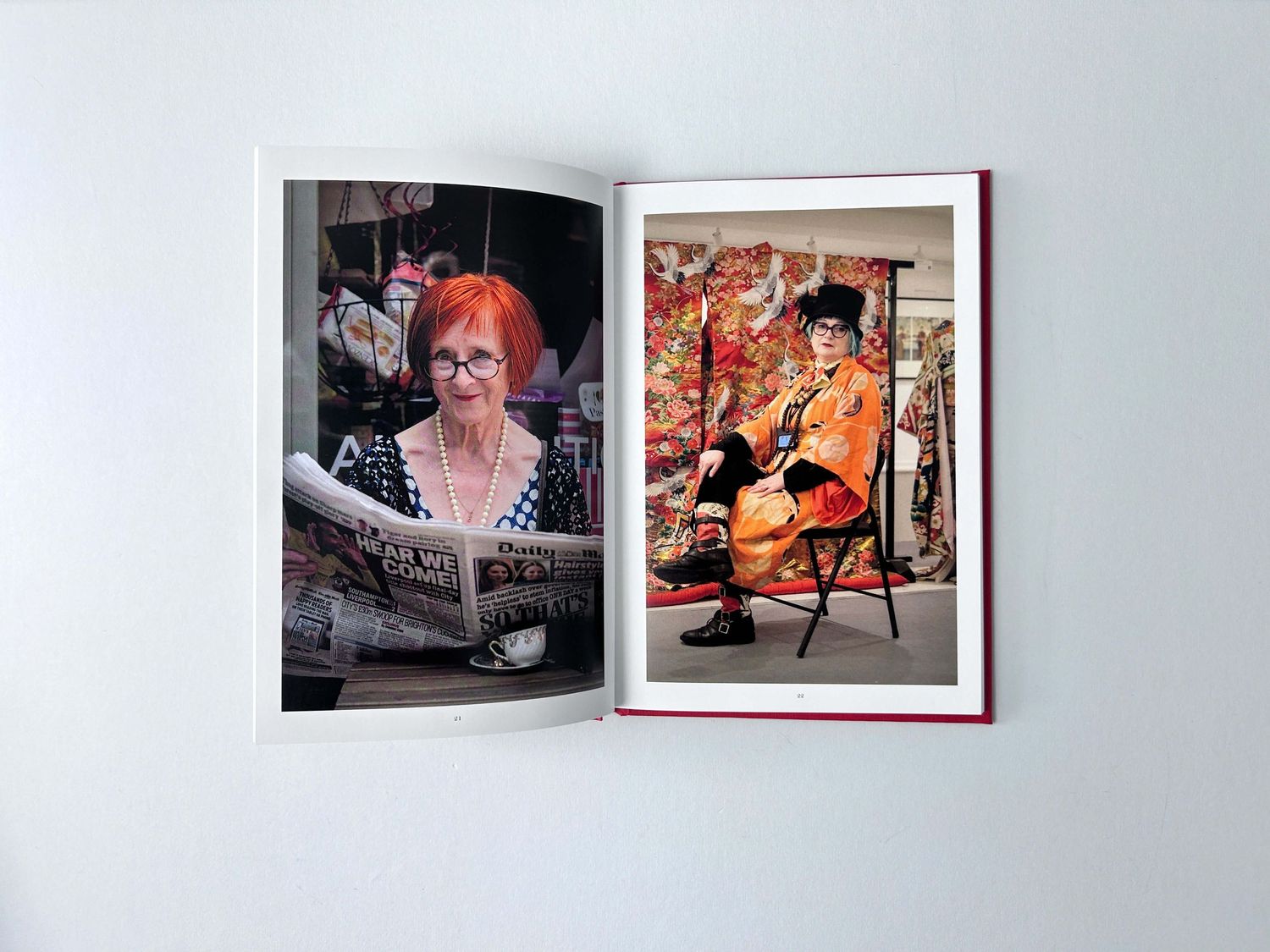 An open book displaying artistic portrait photographs on facing pages about Camden Passage