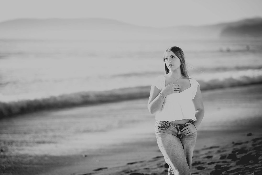 black and white senior portrait session of girl on beach created on california's central coast