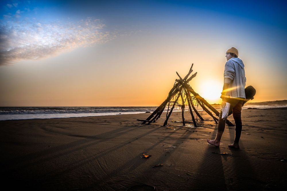 advertisement portrait of lifestyle image of young male on beach, phoitographed on the central coast of california at sunset