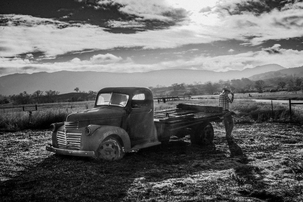 Black and white documentary Photograph of Ranch Hand working the land in Atascadero California