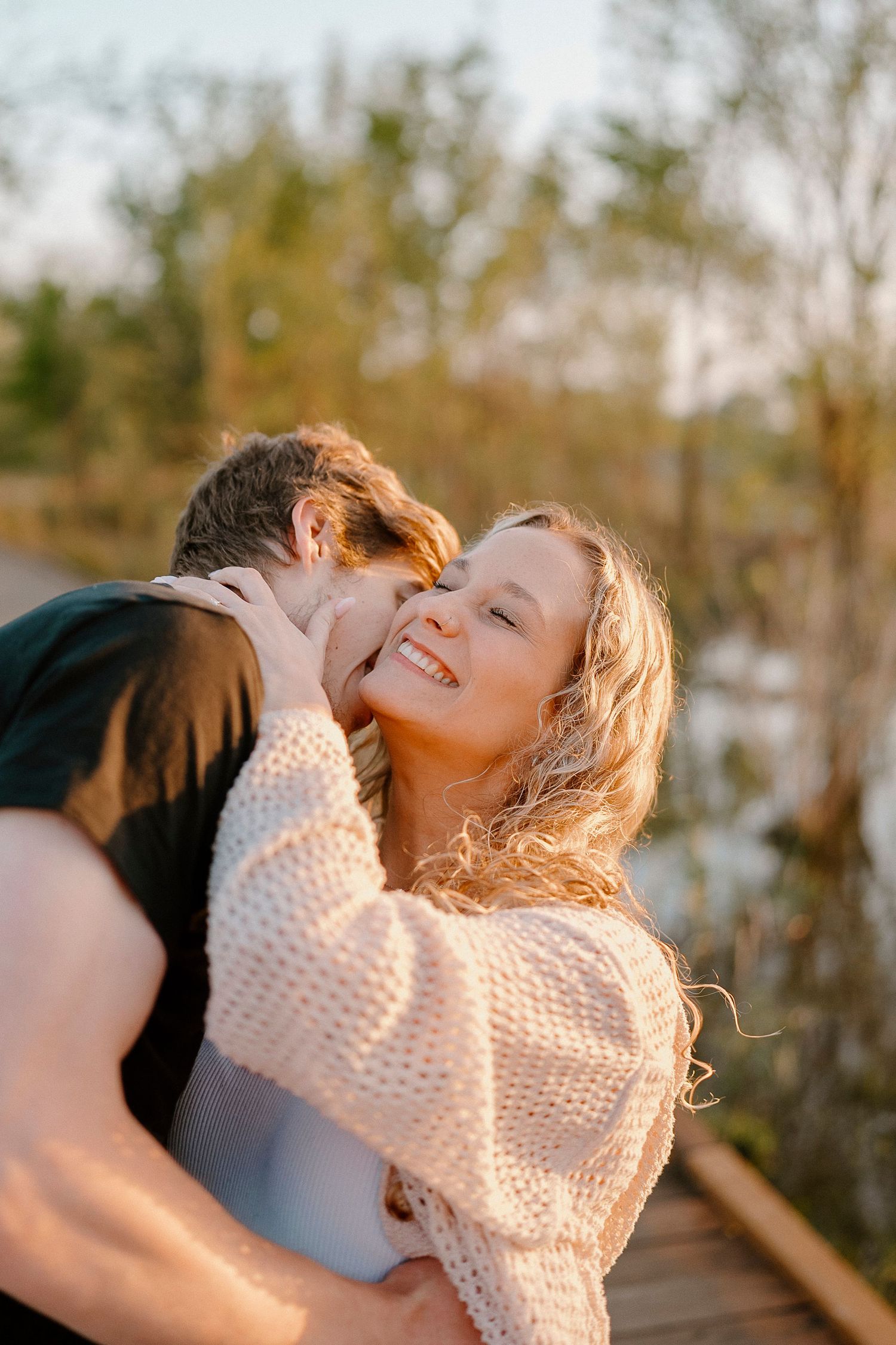 A joyful moment shared between two people during golden hour.