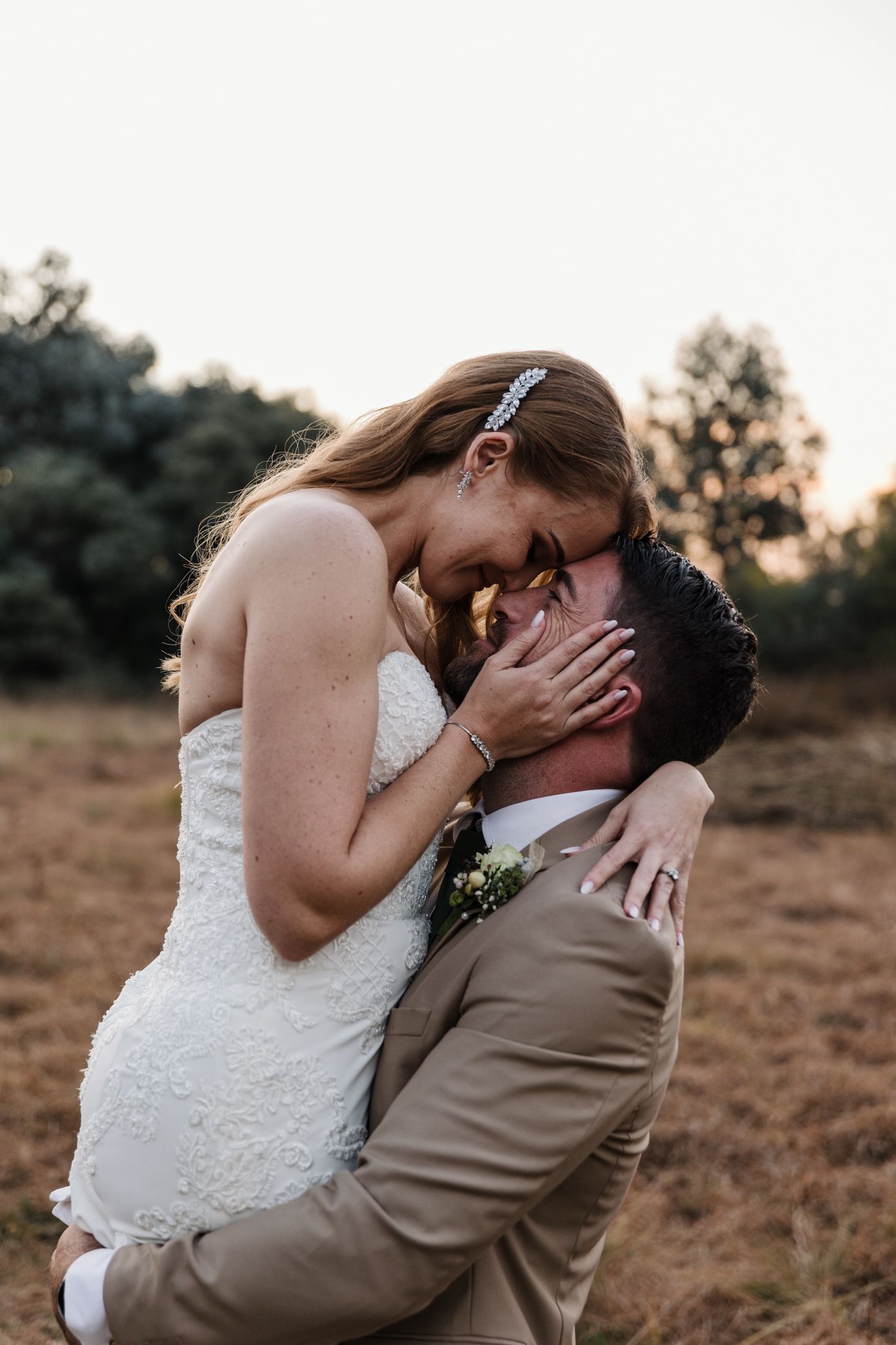 Wedding couple dancing at sunset