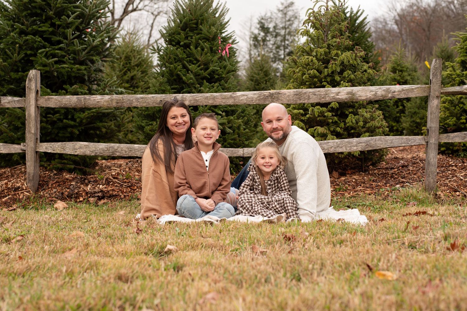 Black and white portrait of large family gathered outdoors.
