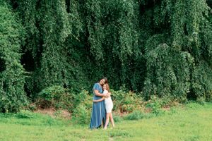 Sweet embrace against lush green foliage background in garden setting.