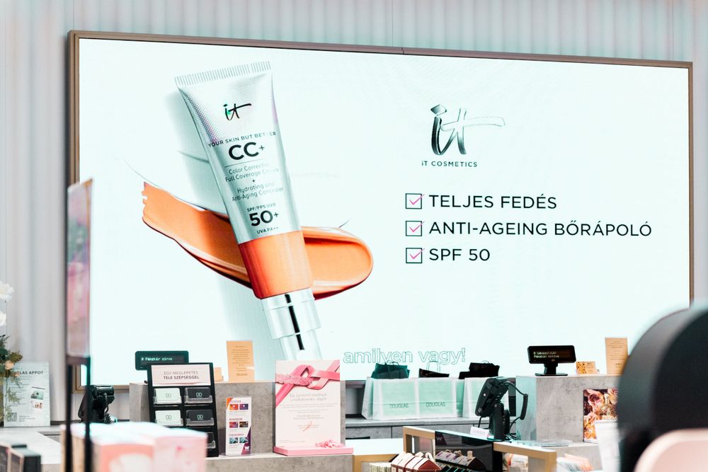 Clean, modern beauty retail display featuring CC creams and skincare products.