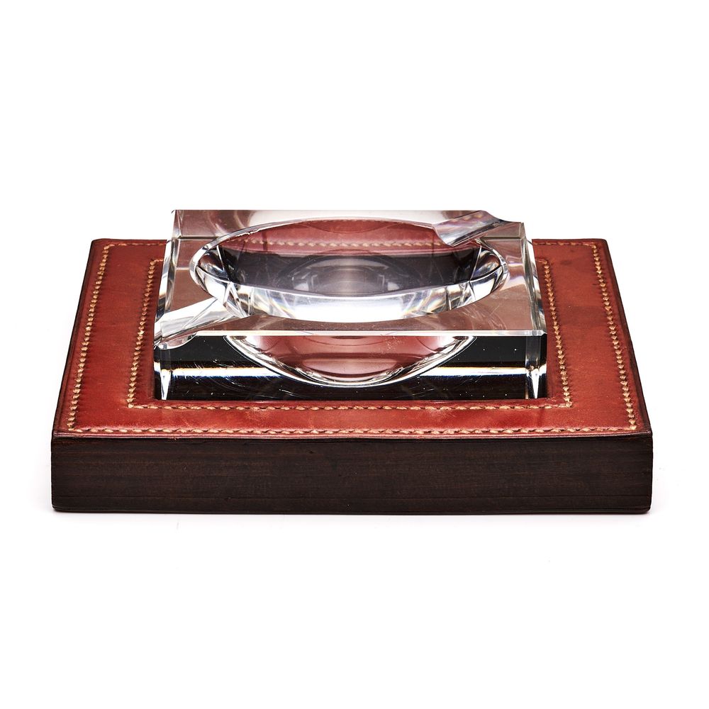 Vintage wooden coaster set with brown leather trim and silver plated holders displayed in a row on white background.