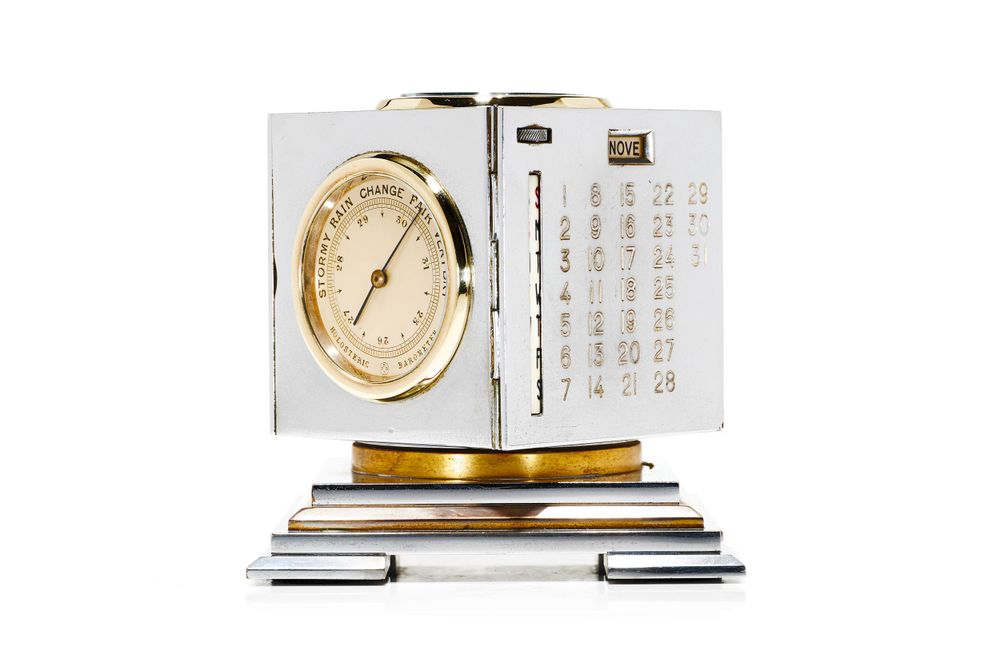 Modern desk calendar with gold clock integration shown from multiple viewing angles.