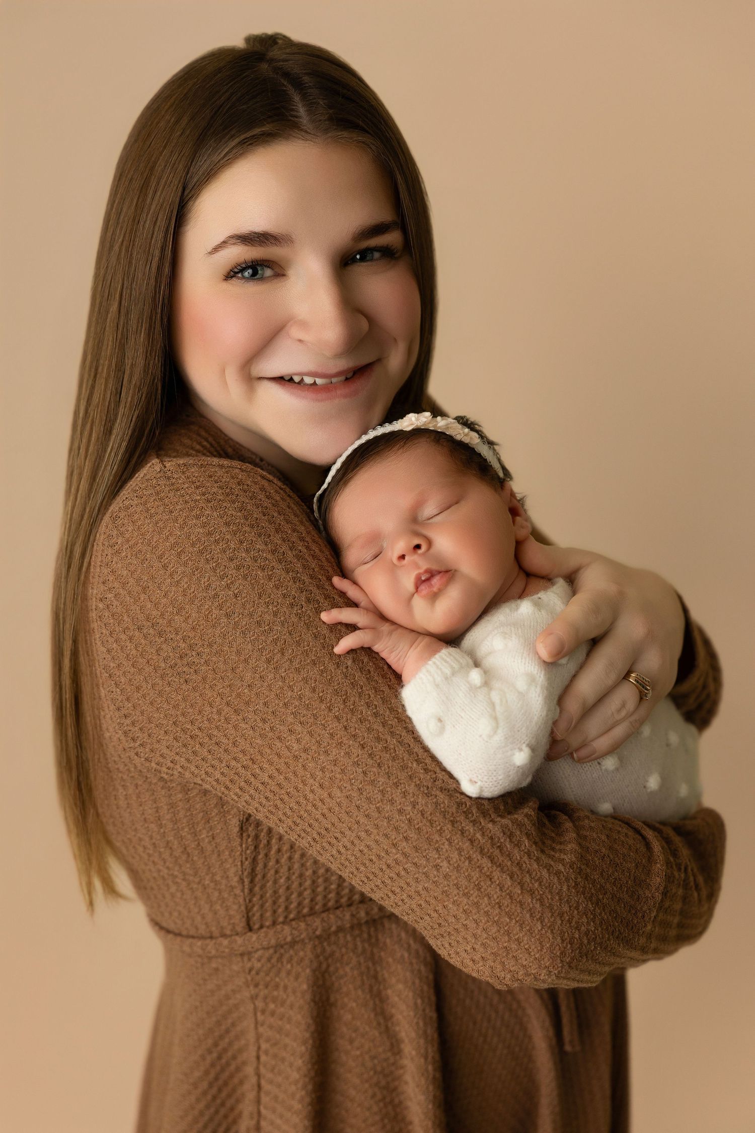 A series of photos showing someone in a brown sweater hugging a plush toy in different playful poses.