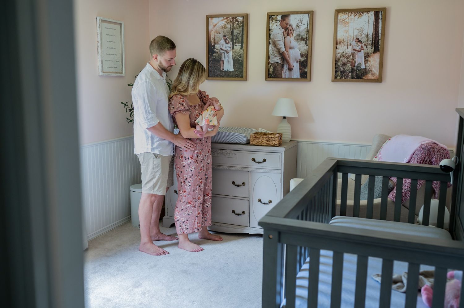 Couple holding newborn baby nursery lifestyle newborn session photoshoot in home Palm Bay Melbourne Cocoa Beach Vero Florida Brevard County