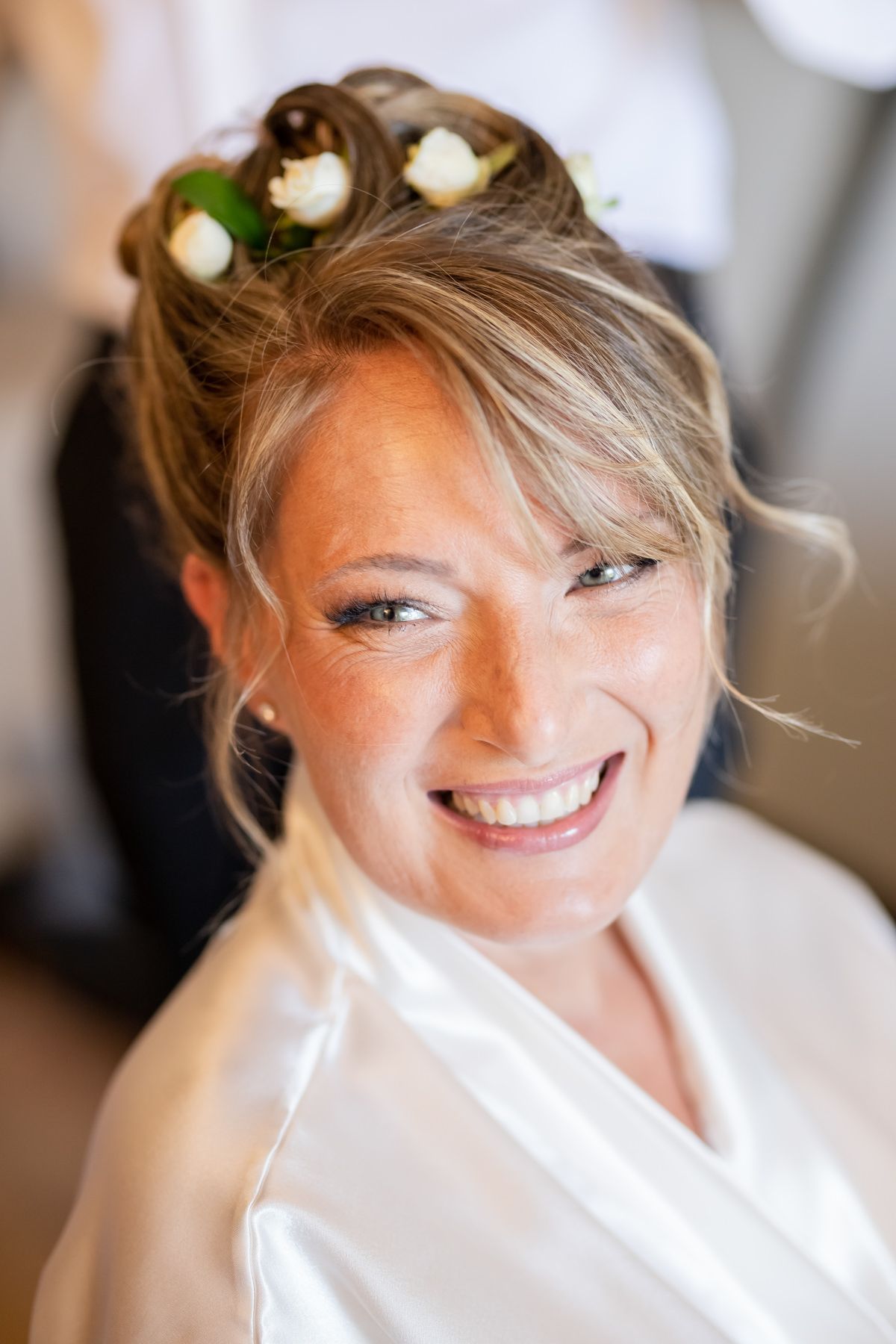 Joyful wedding preparation moments captured in natural light.
