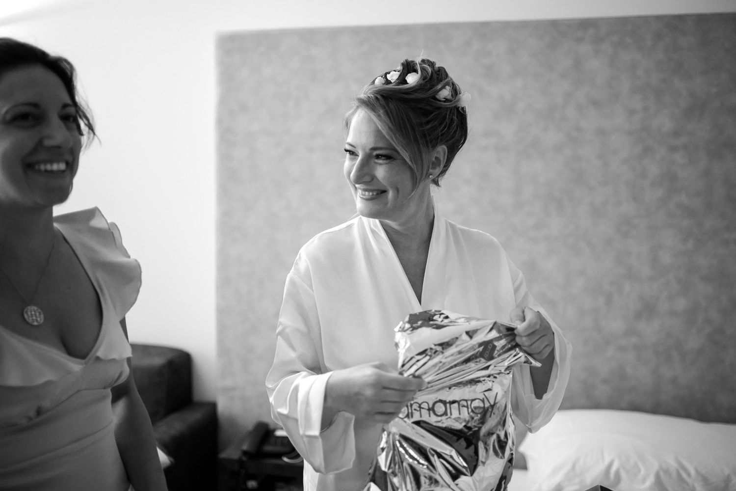 Black and white candid moments during wedding day preparations.