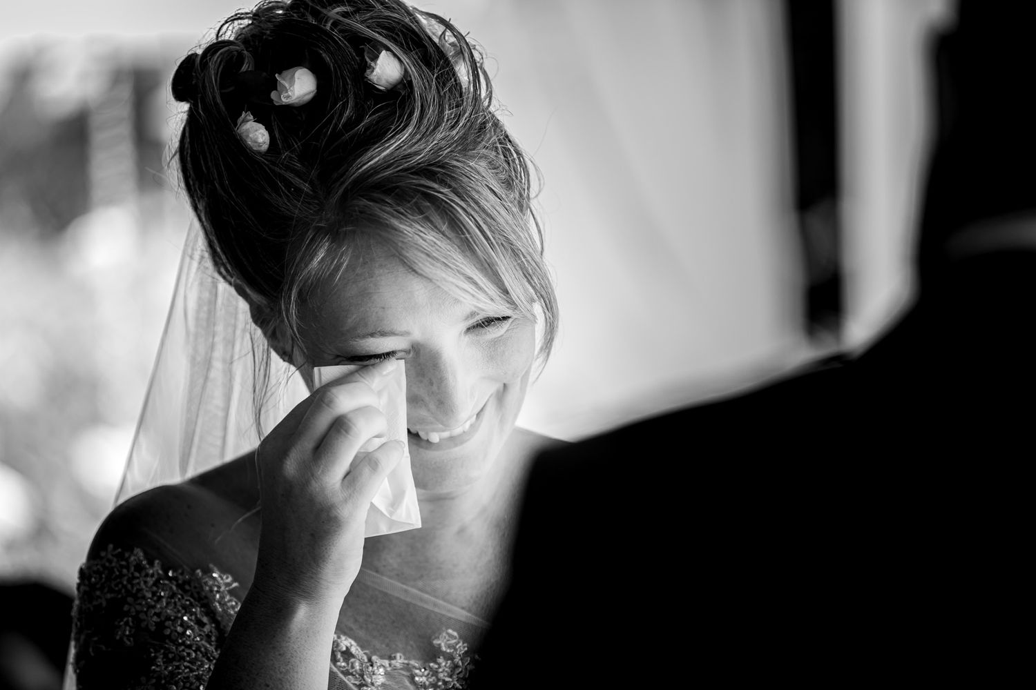 Black and white artistic wedding photography showing emotional candid moments.