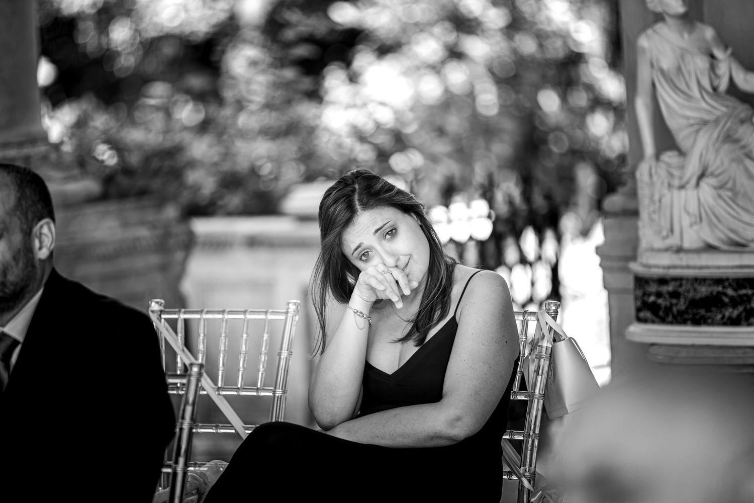 Black and white candid shots of wedding reception with elegant table settings.