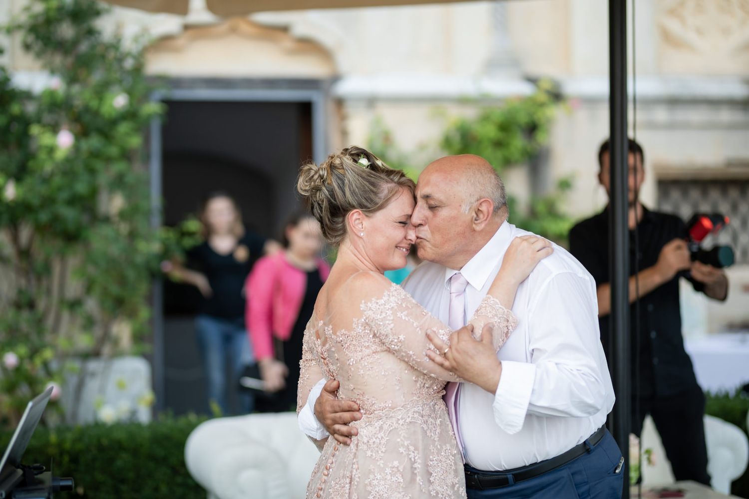 Romantic moments captured during an elegant outdoor wedding celebration.