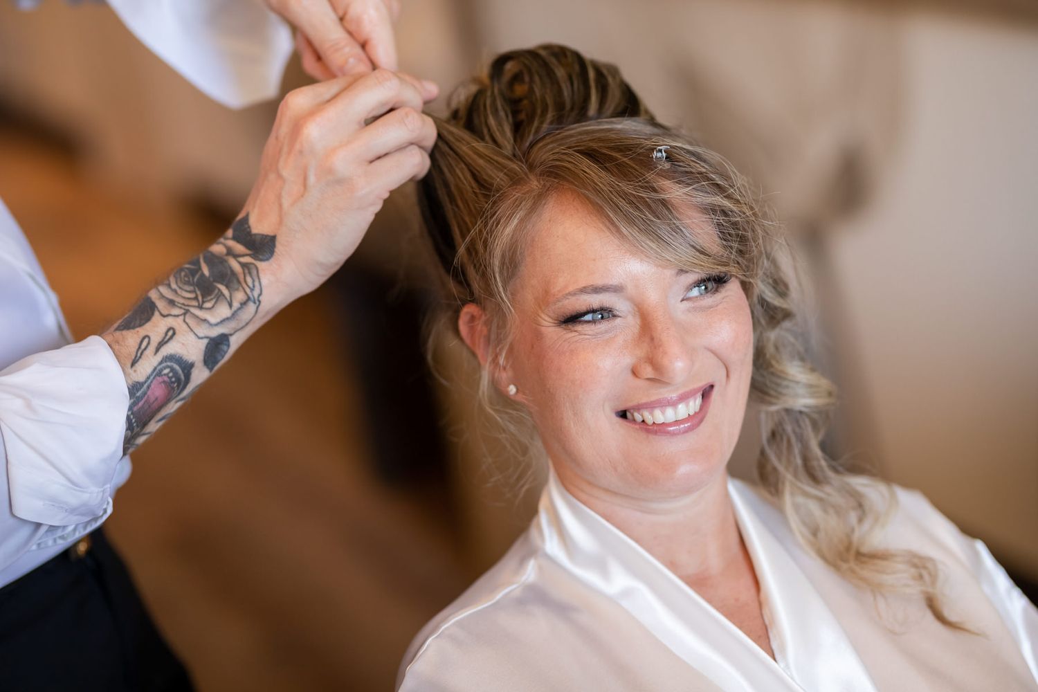 Getting ready preparations with hair and makeup styling for a wedding day.