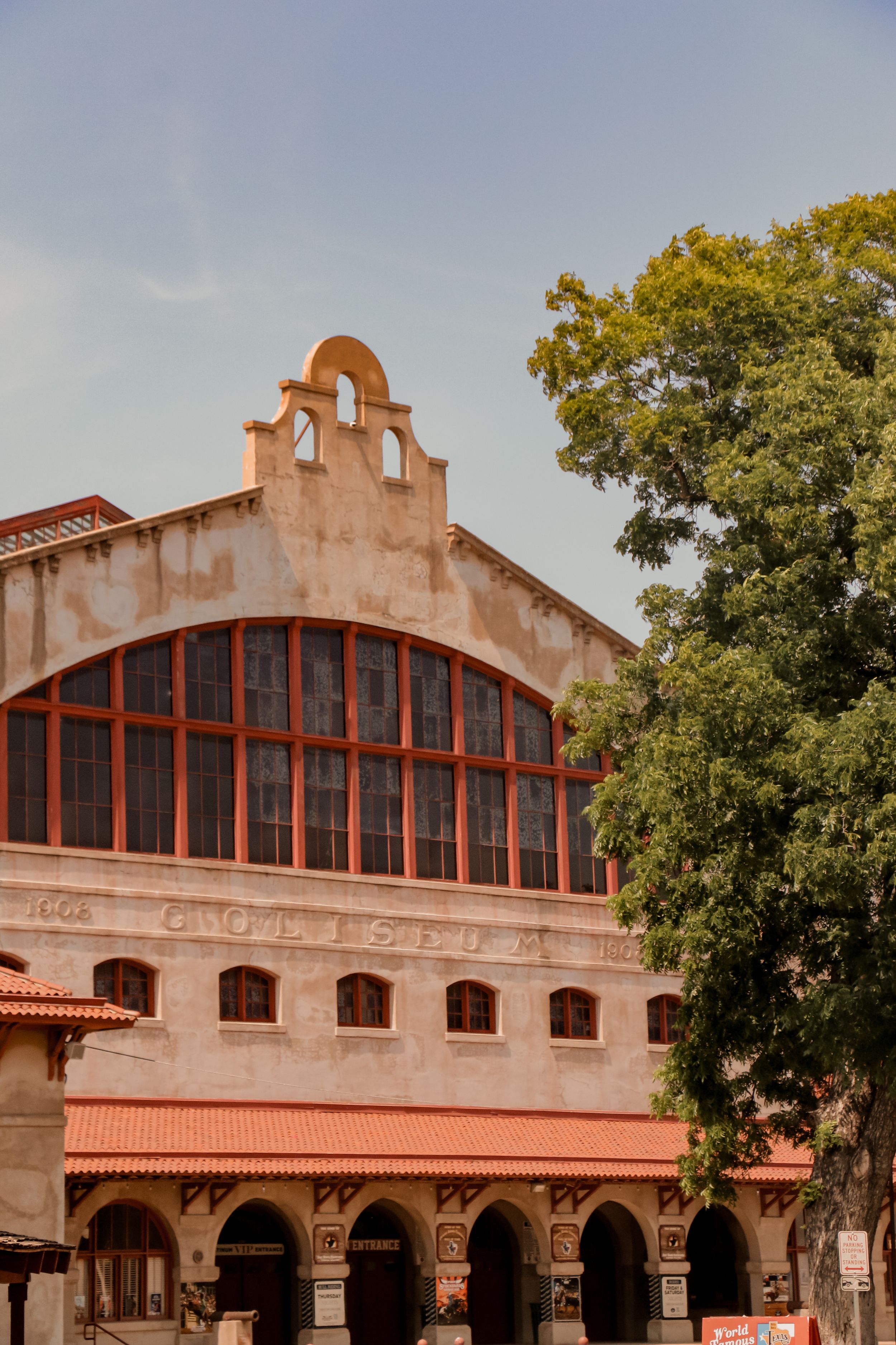 Historic Spanish colonial style building with arched windows and ornate architectural details in Fort Worth Stockyards.