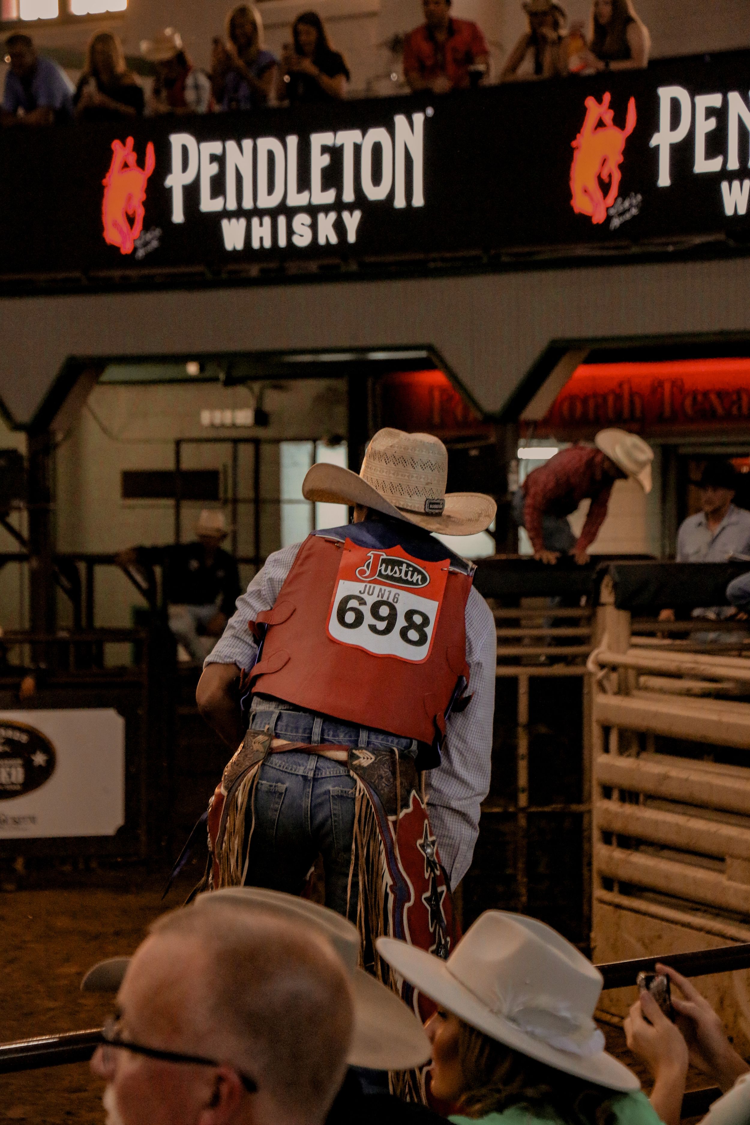 Rodeo participant wearing number 698 at Pendleton Whisky sponsored event.